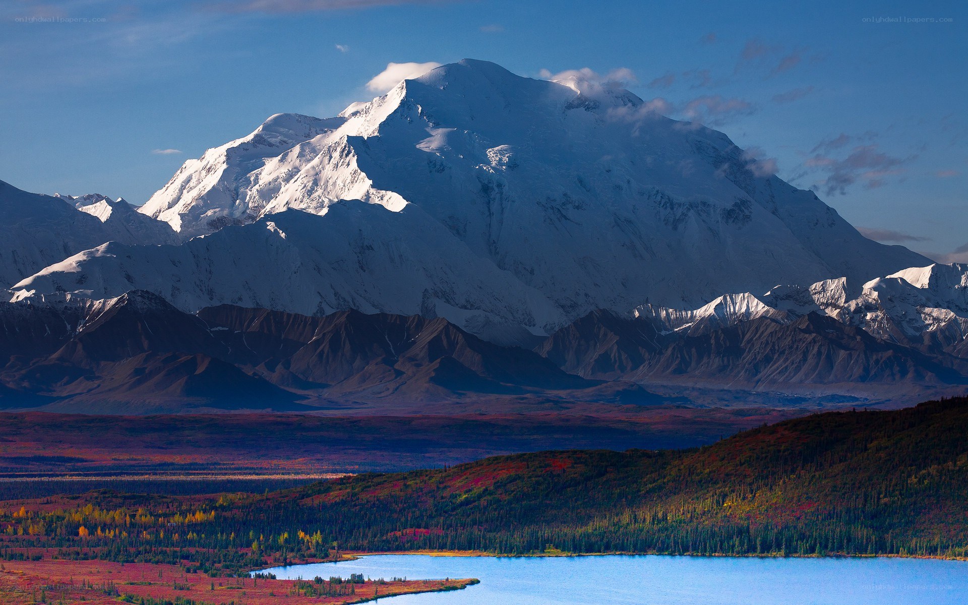 Snow-capped mountain and autumn lake