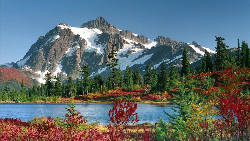 Snow-capped mountain and autumn lake
