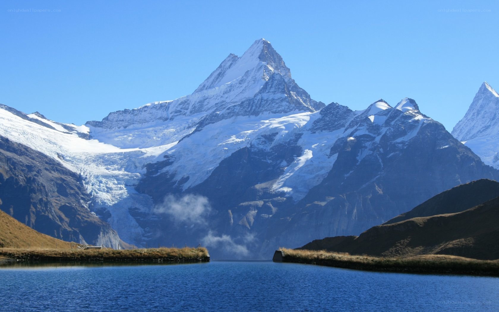 snow-capped mountain and lake