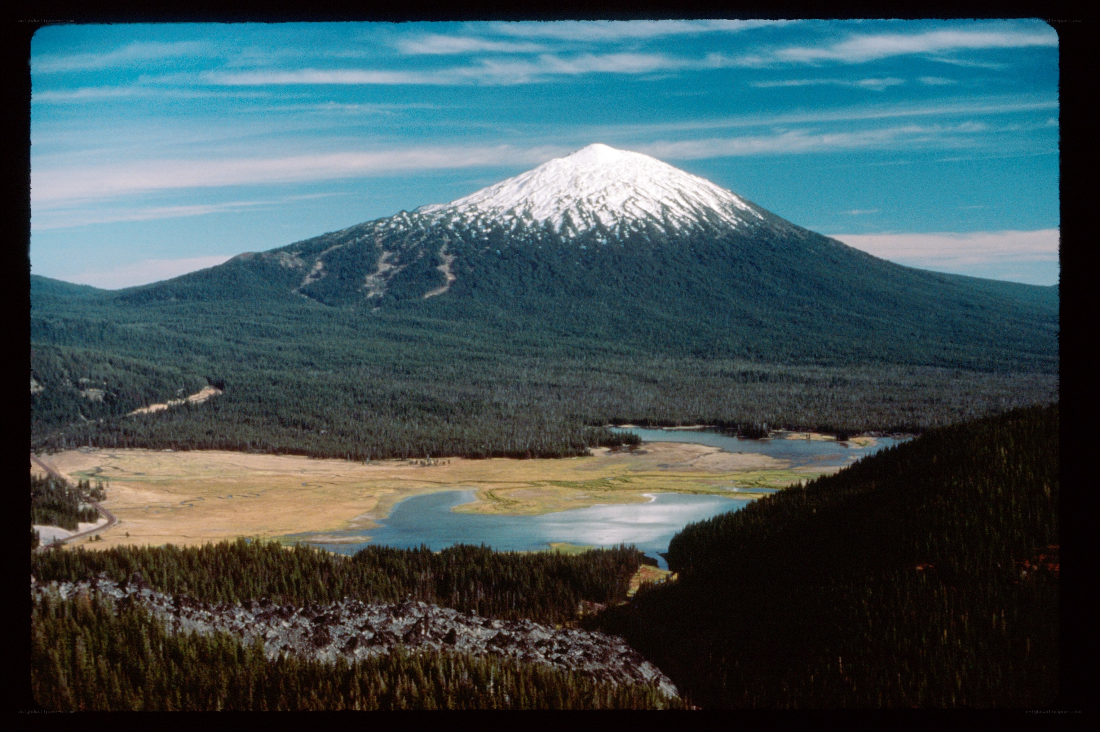 Snow-capped mountain and lake