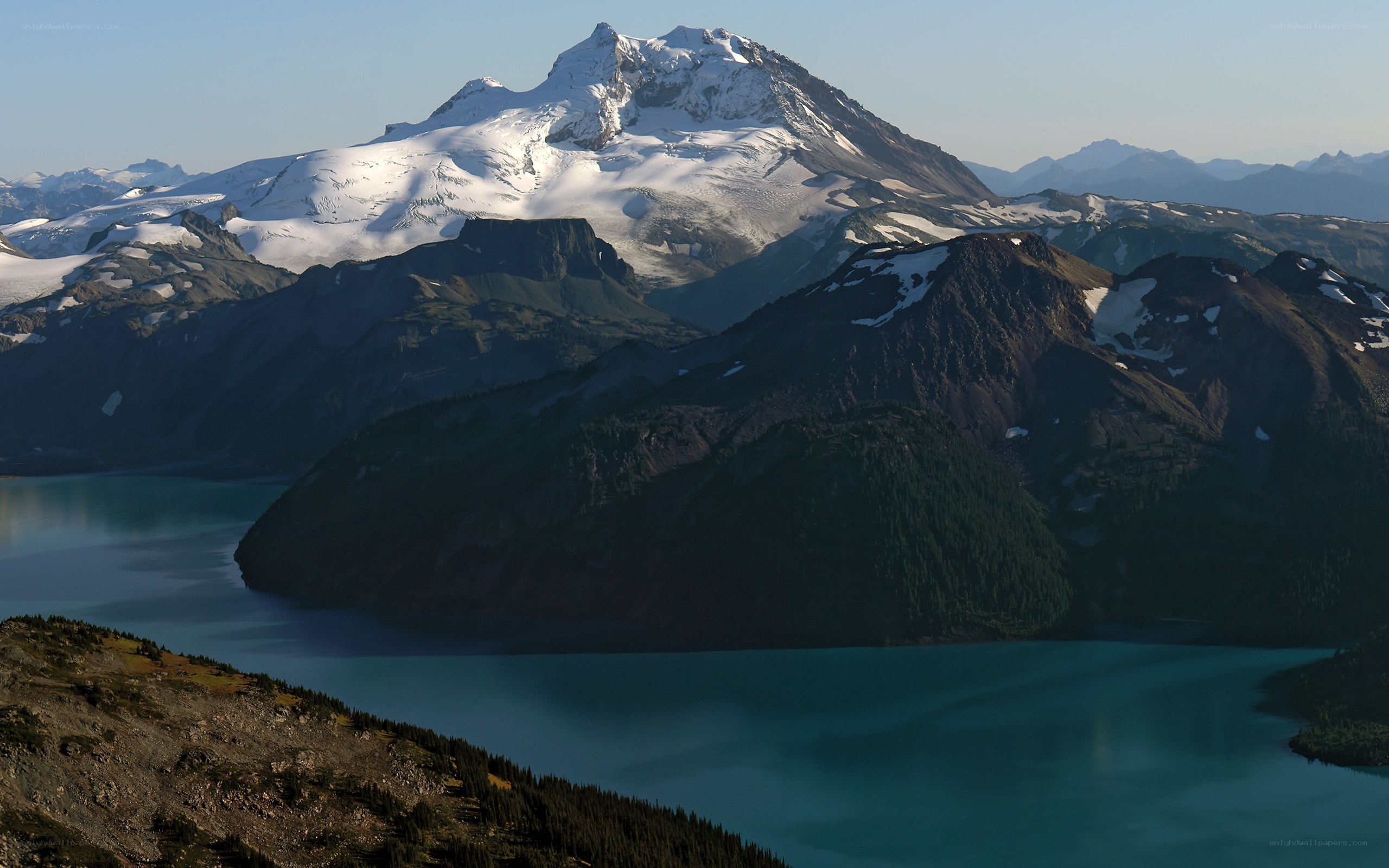 snow-capped mountain and turquoise lake
