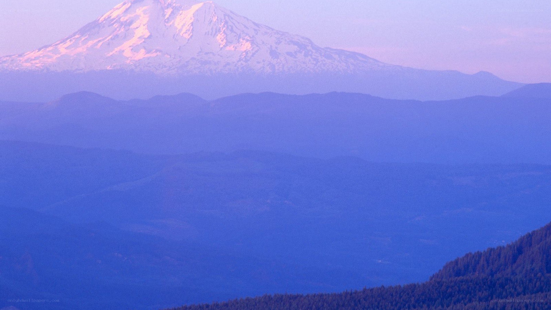 Snow-capped mountain at dawn