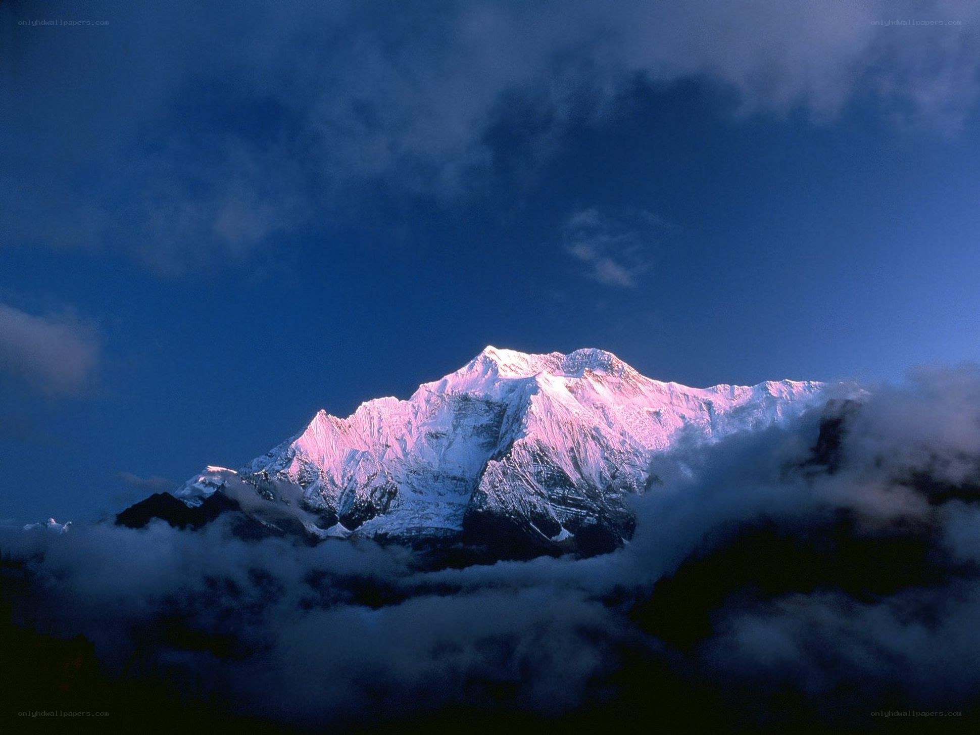 Snow-capped mountain at dawn