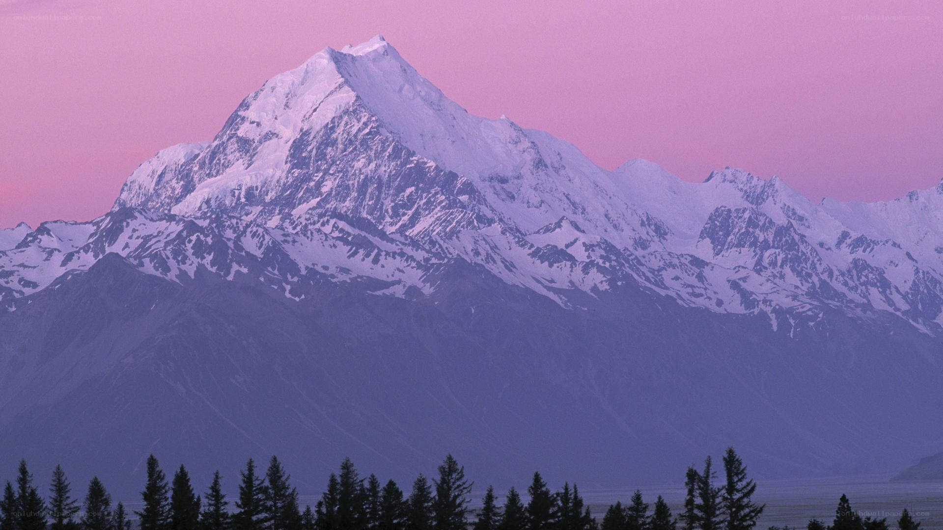 snow-capped mountain at dusk