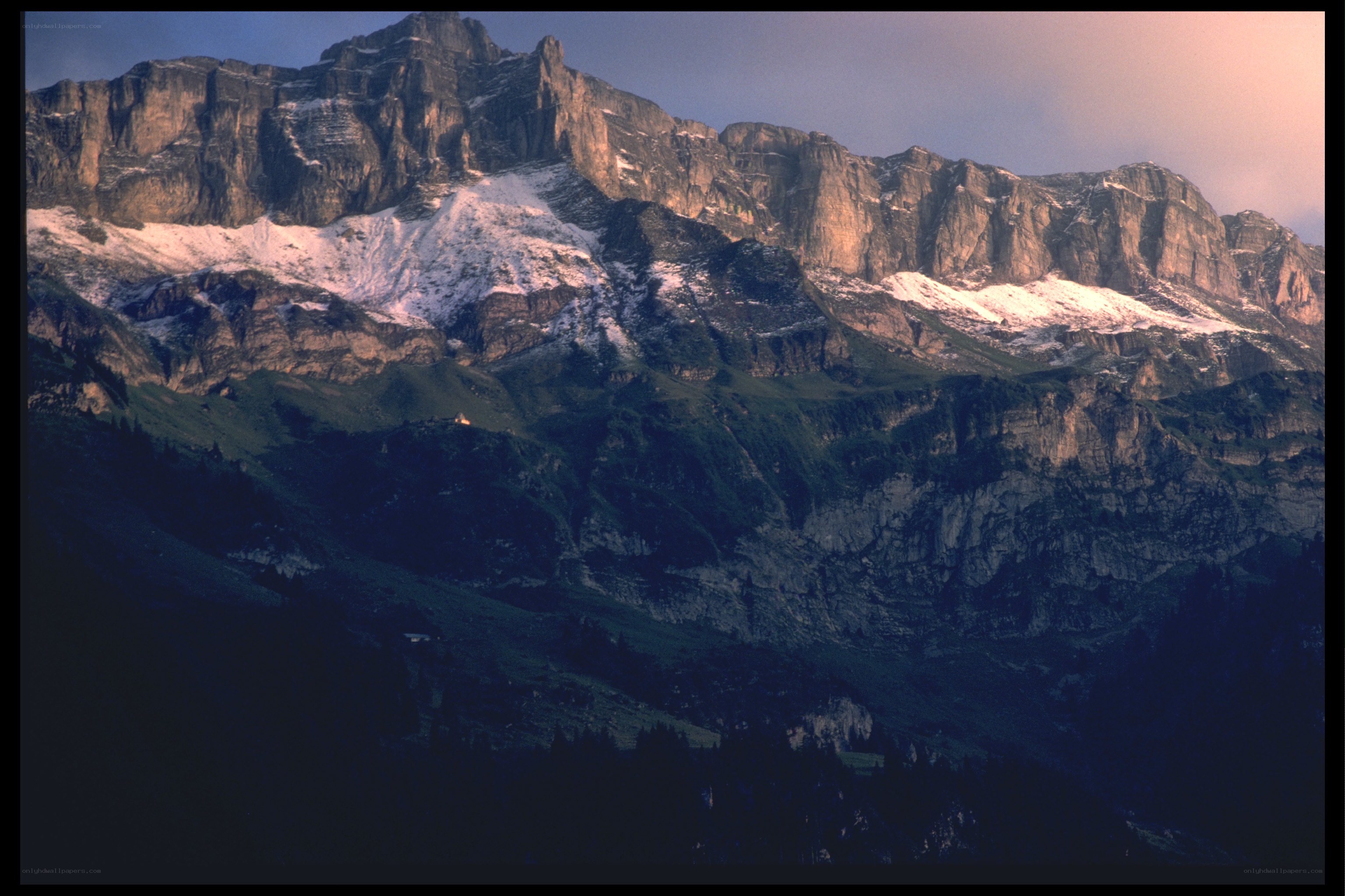 Snow-capped mountain at dusk