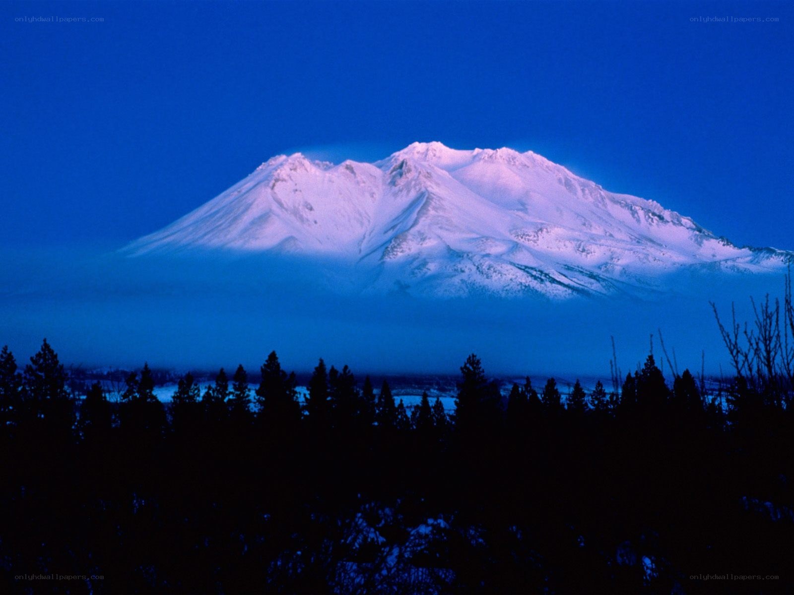 Snow-capped mountain at dusk