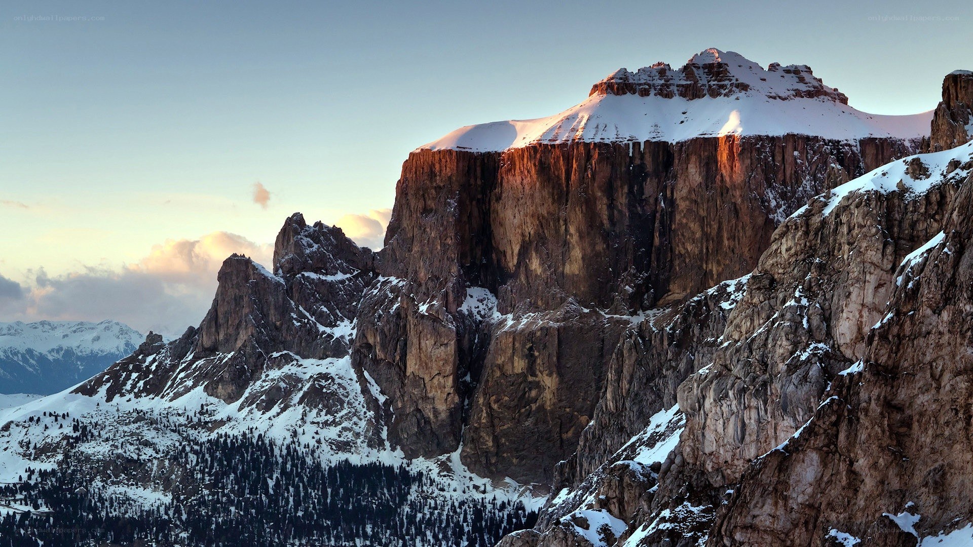 Snow-capped mountain at sunrise