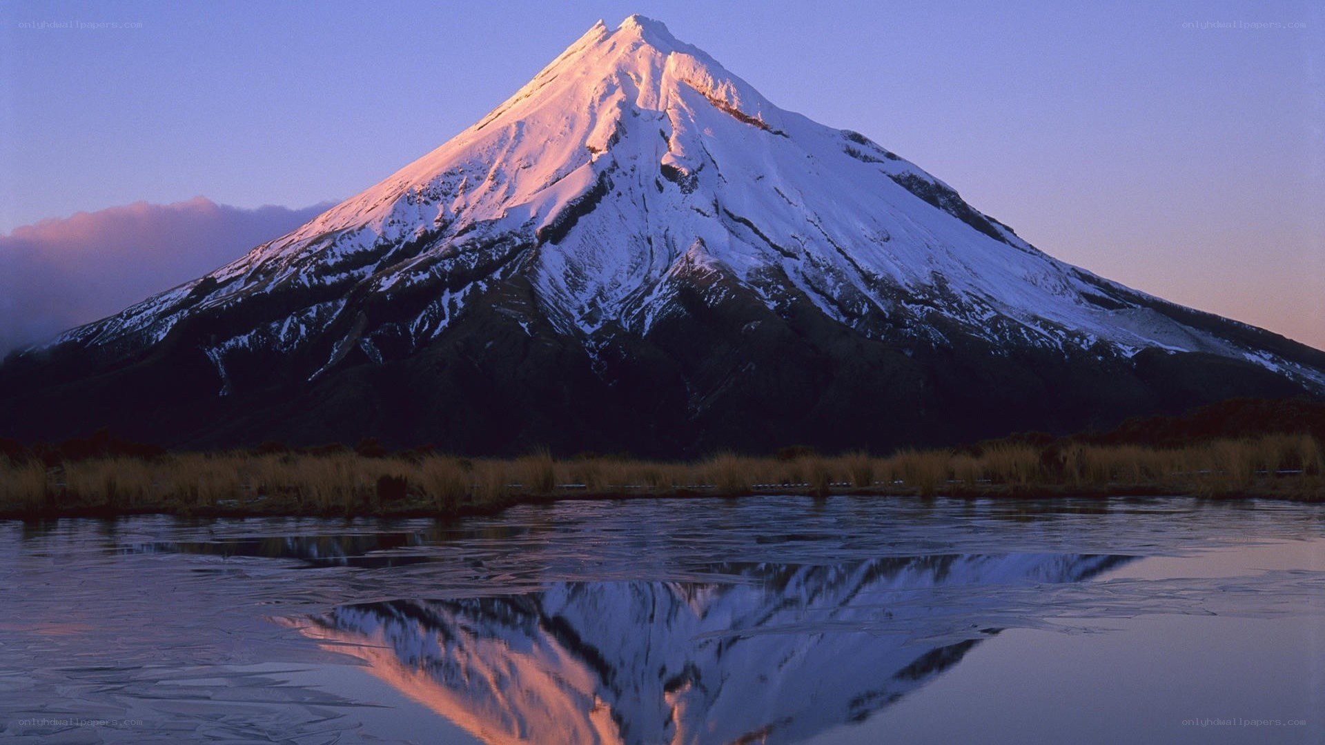 Snow-capped mountain at sunrise