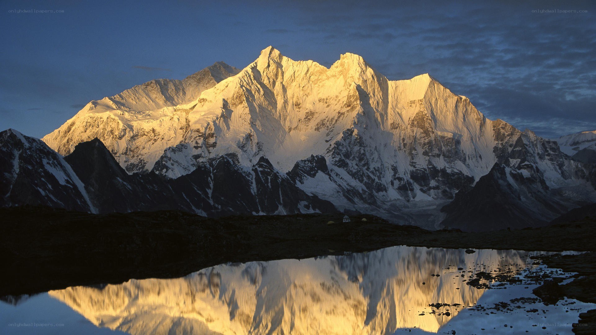 Snow-capped mountain at sunrise