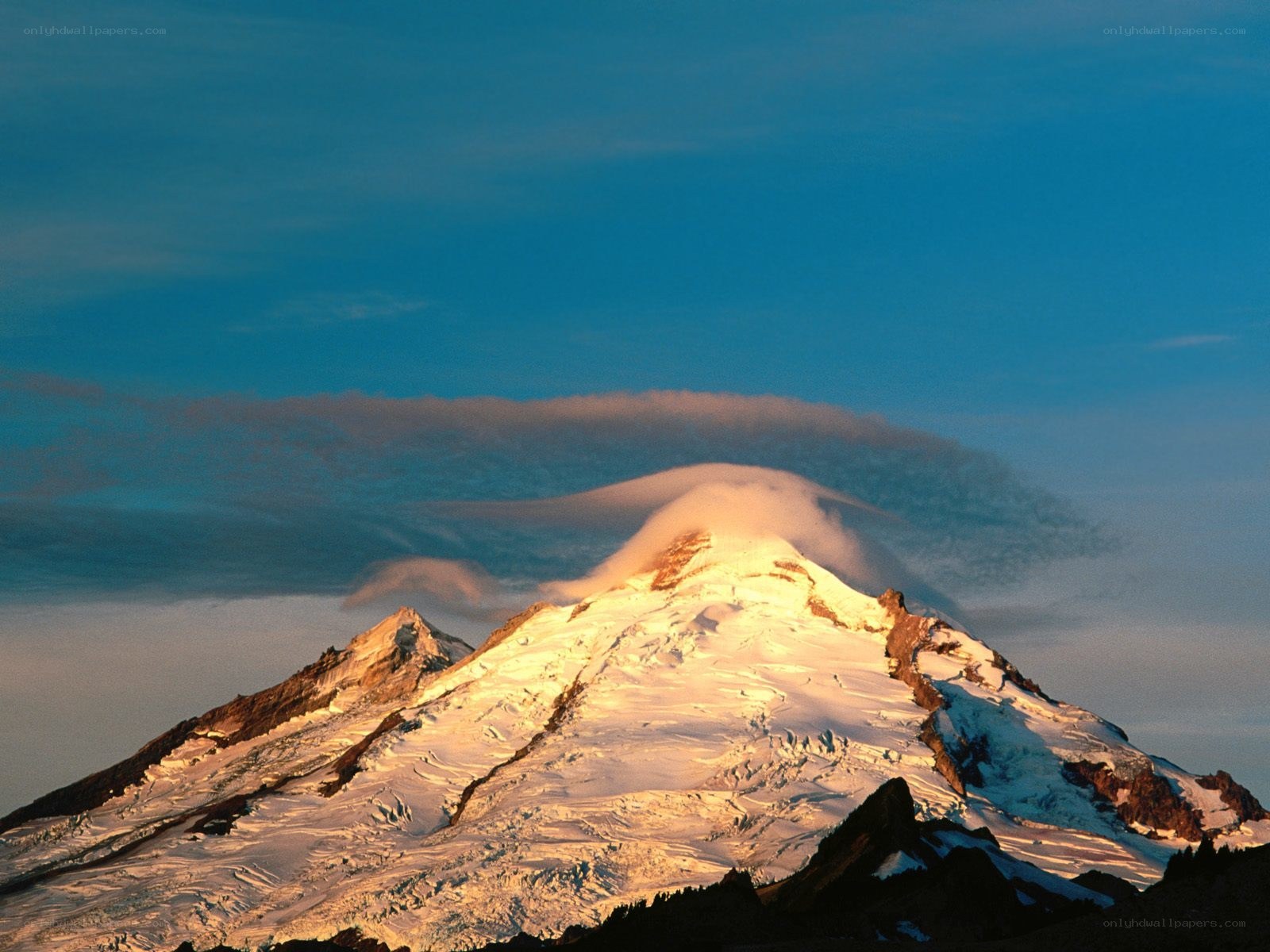 Snow-capped mountain at sunrise