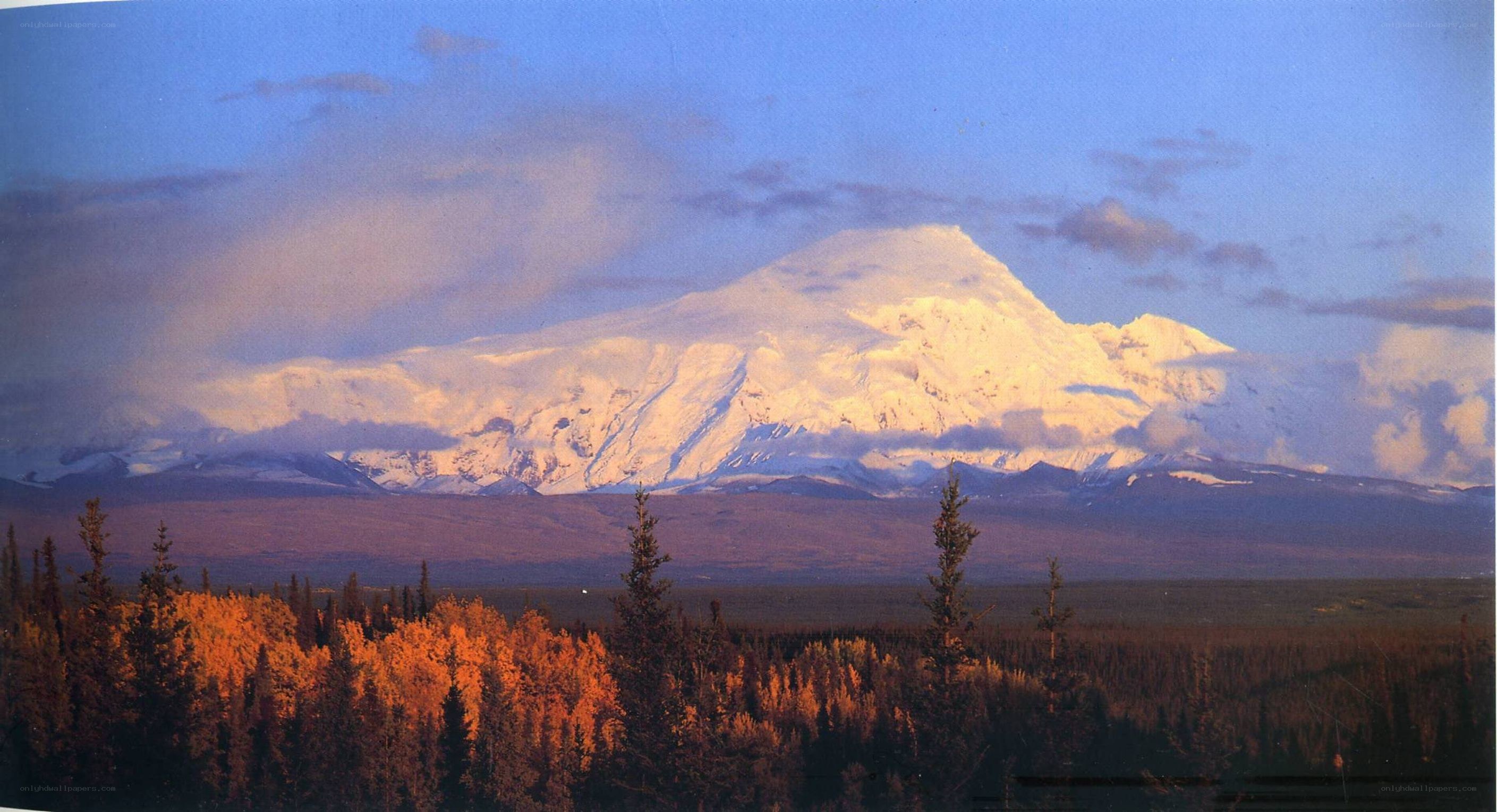 snow-capped mountain at sunset