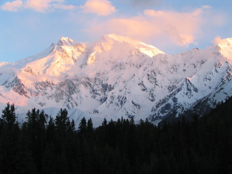 Snow-capped mountain at sunset