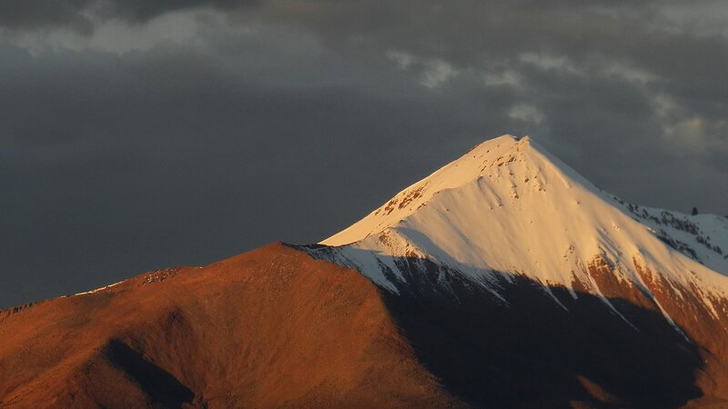 snow-capped mountain at sunset