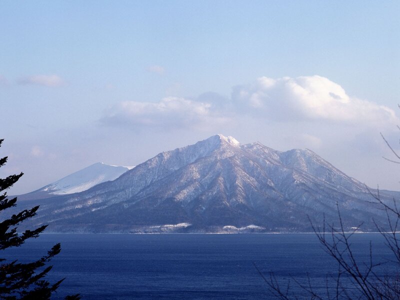 Snow-capped mountain by the sea