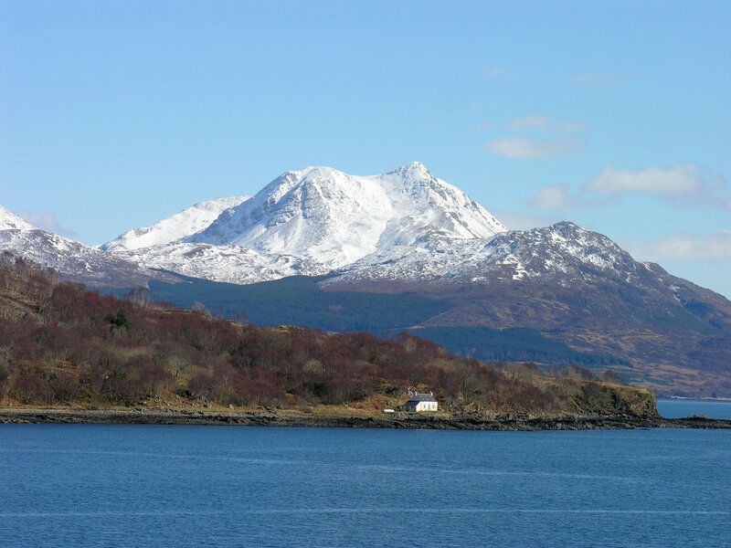 Snow-capped mountain by the sea