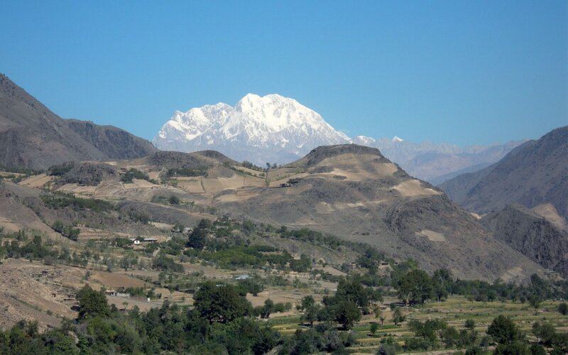 Snow-capped mountain in valley