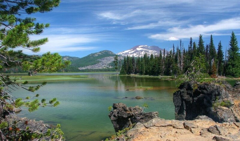 Snow-capped Mountain Lake — Blue, Serene, Afternoon, Photograph, Pine Trees, Rocks