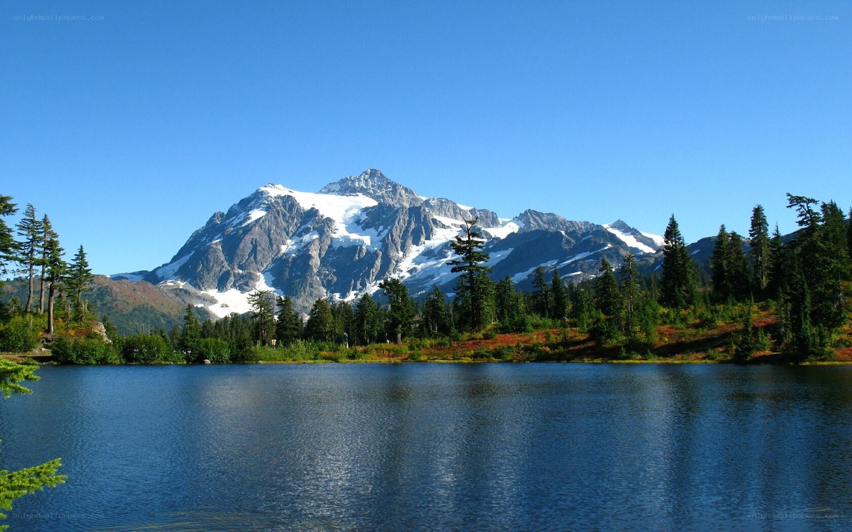 Snow-capped mountain lake landscape