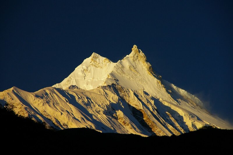 Snow-capped mountain peak at sunrise