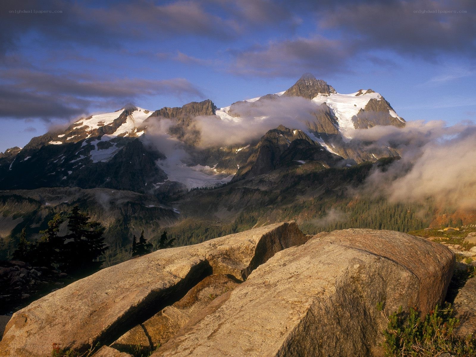 Snow-capped mountain peak at sunrise