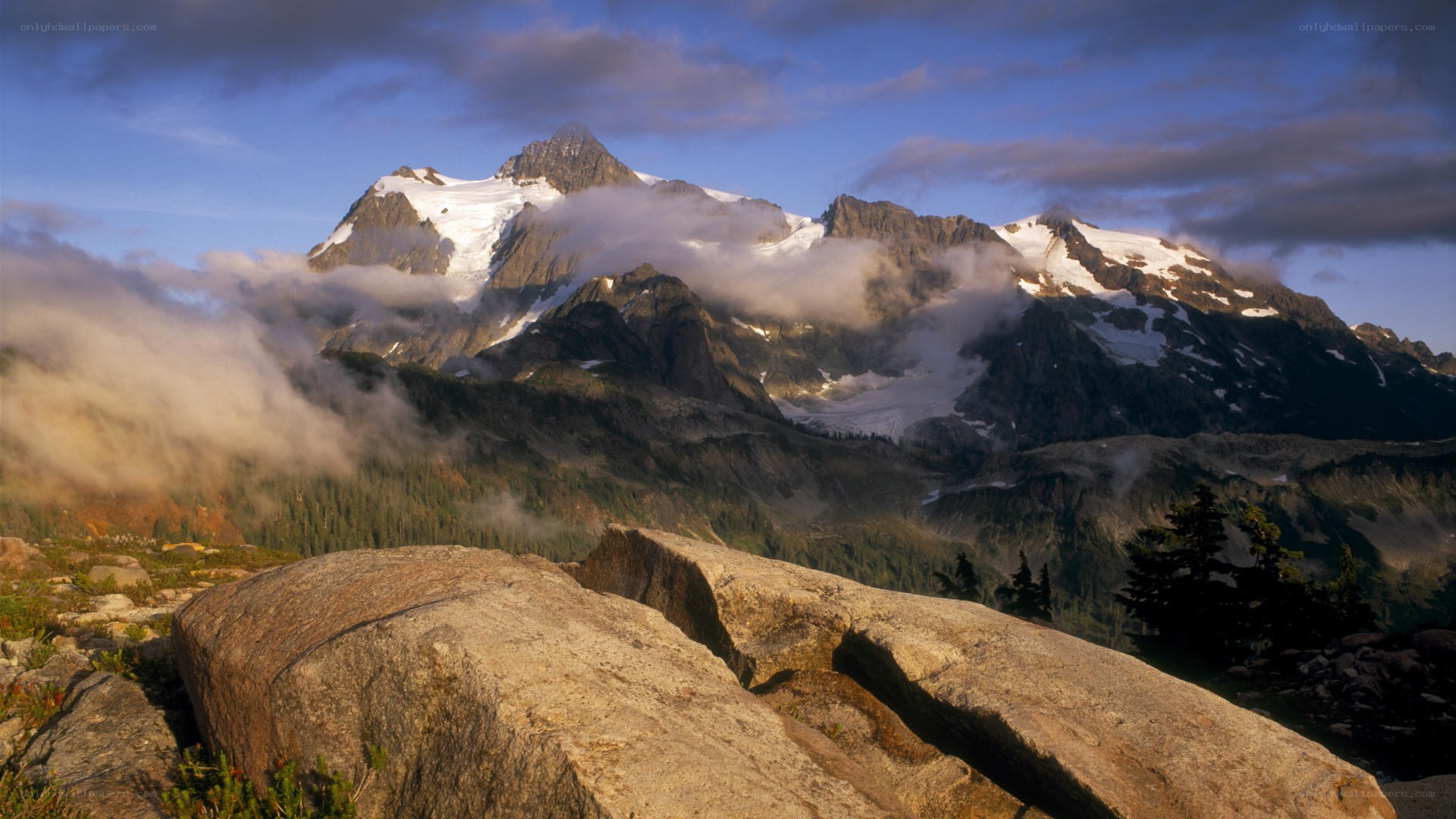 Snow-capped mountain peak at sunrise