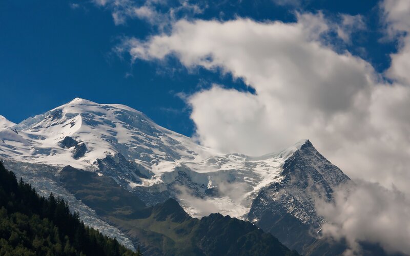 Snow-capped Mountain Peak — Blue, Dramatic, Afternoon, Photograph, Clouds, Forest, Glacier