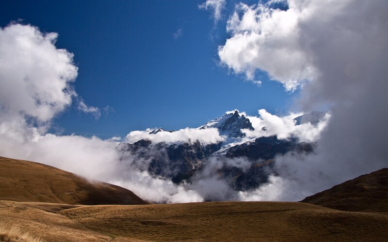 Snow-capped Mountain Peak — Blue, Dramatic, Afternoon, Photograph, Clouds, Hills, Sky