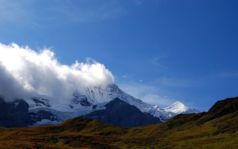 Snow-capped Mountain Peak — Blue, Serene, Afternoon, Photograph, Clouds, Hills