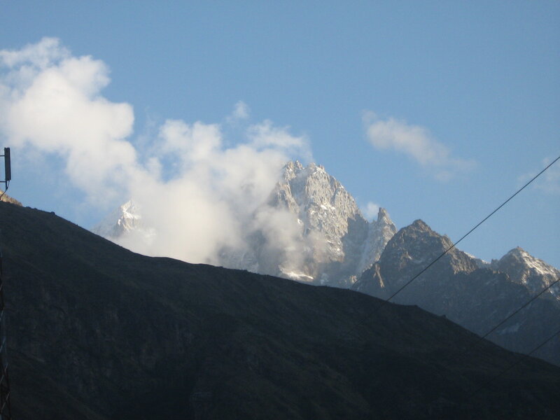 Snow-capped Mountain Peak — Blue, Serene, Afternoon, Photograph, Clouds, Power Lines