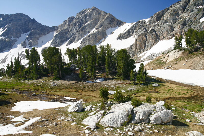 Snow-capped Mountain Peak — Blue, Serene, Afternoon, Photograph, Trees, Rocks