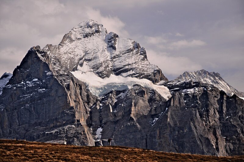 Snow-capped Mountain Peak — Gray, Dramatic, Afternoon, Photograph, Hiker