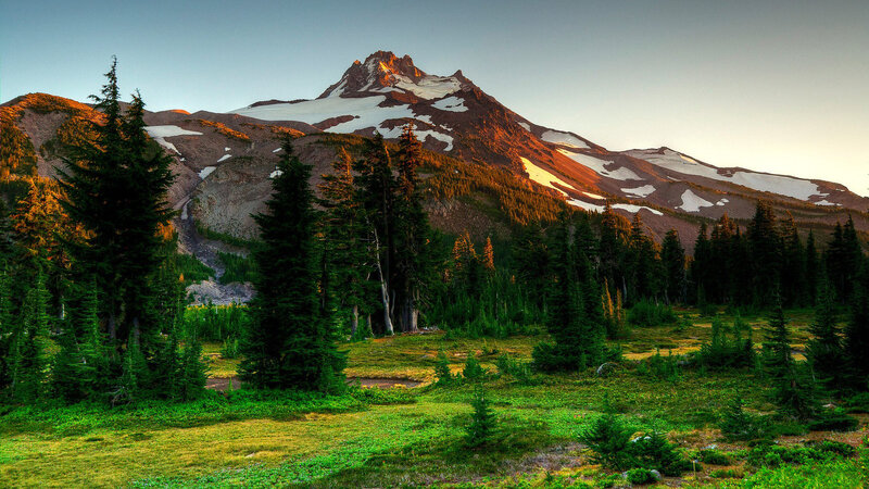 Snow-capped Mountain Peak — Green, Serene, Sunset