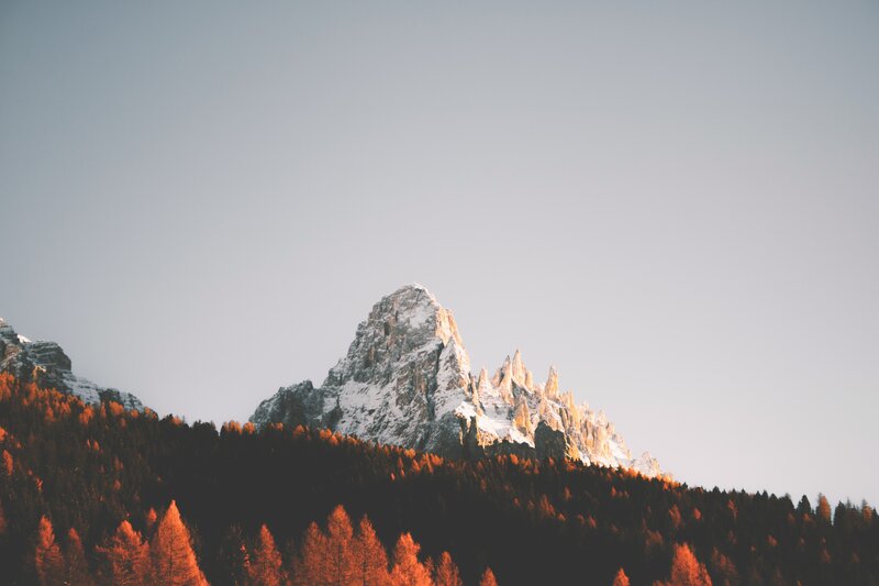 Snow-capped Mountain Peak — Orange, Serene