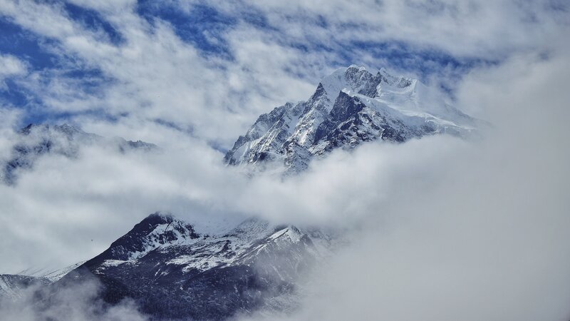 Snow-capped Mountain Peak — White, Dramatic, Photograph, Clouds