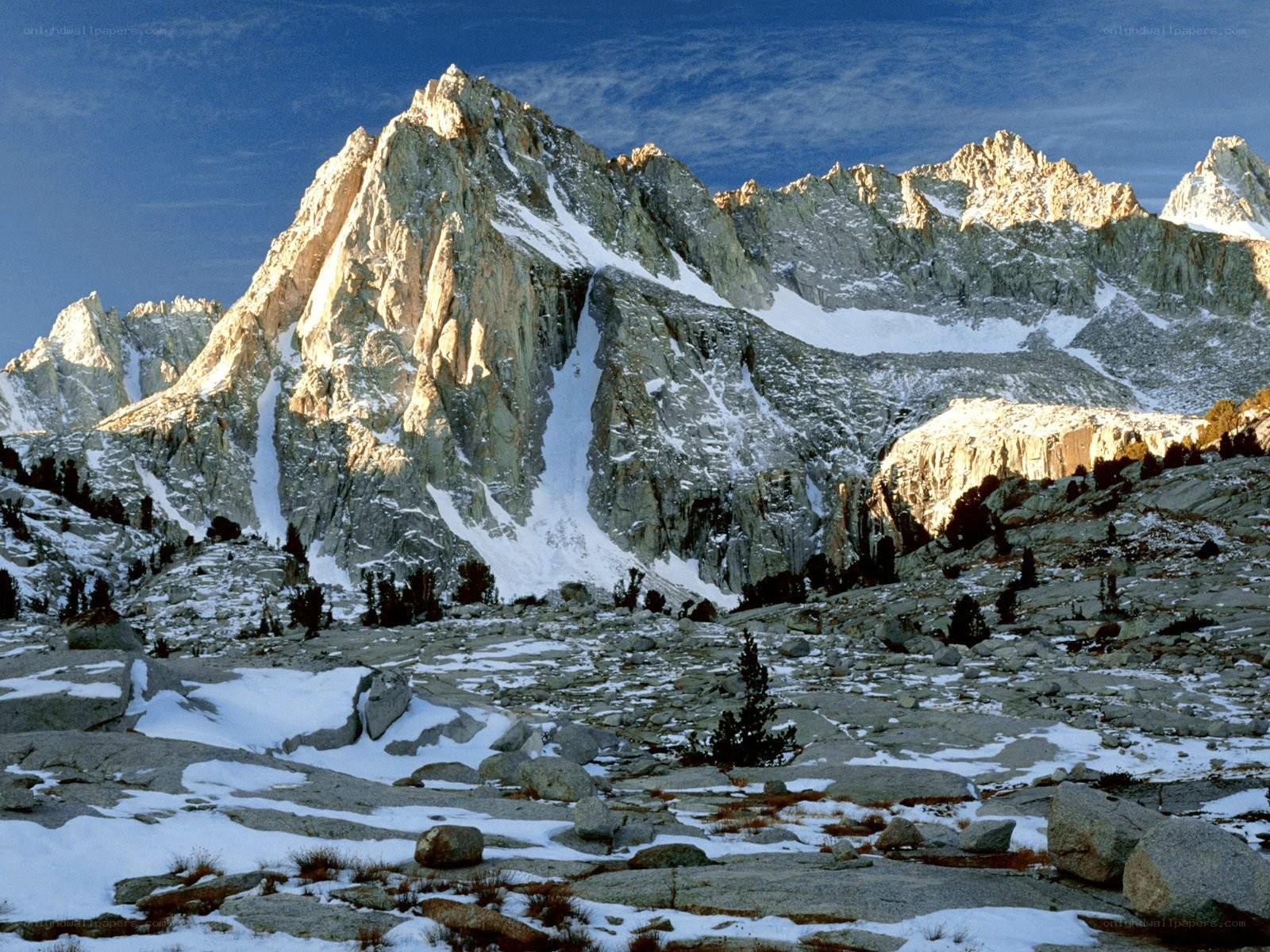 Snow-capped mountain peaks at dawn