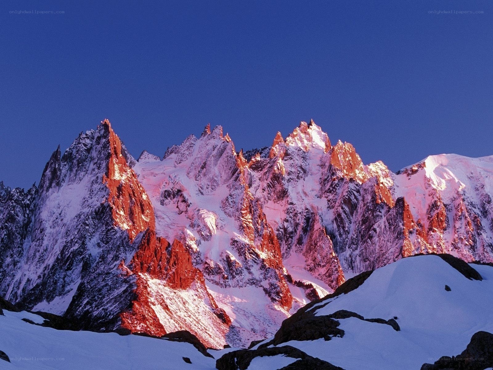 snow-capped mountain peaks at dawn