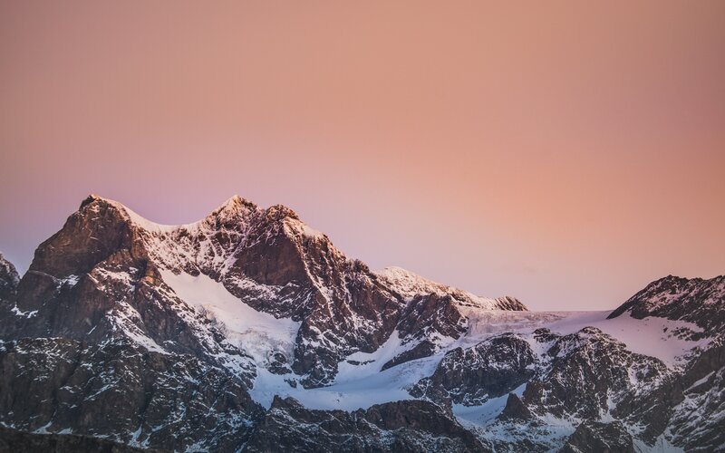 Snow-capped Mountain Peaks — Pink, Serene, Sunset