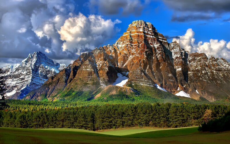 Snow-capped Mountain Range — Blue, Dramatic, Afternoon, Photograph, Forest, Clouds, Grassland