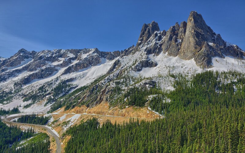 Snow-capped Mountain Range — Blue, Serene, Afternoon, Photograph, Forest, Road