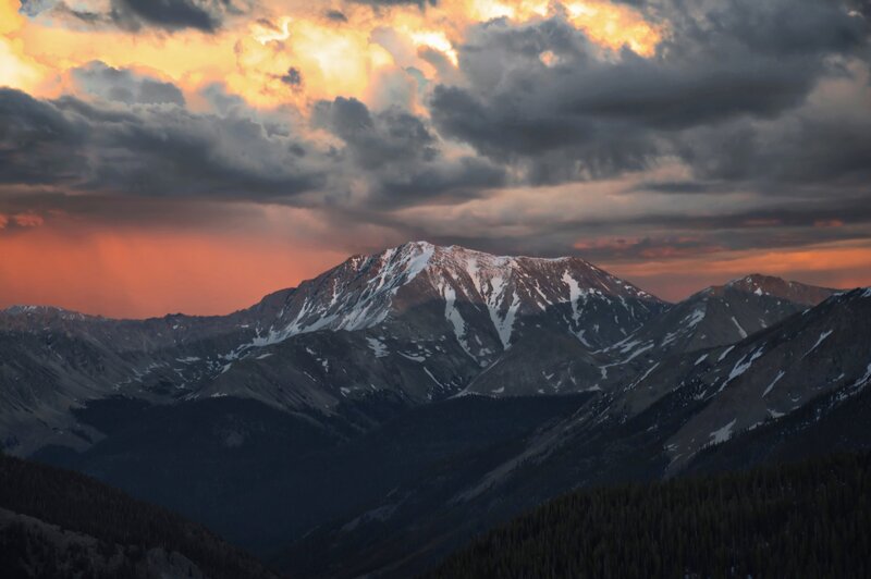 Snow-capped Mountain Range — Orange, Dramatic, Sunset, Photograph, Mountains, Clouds, Forest