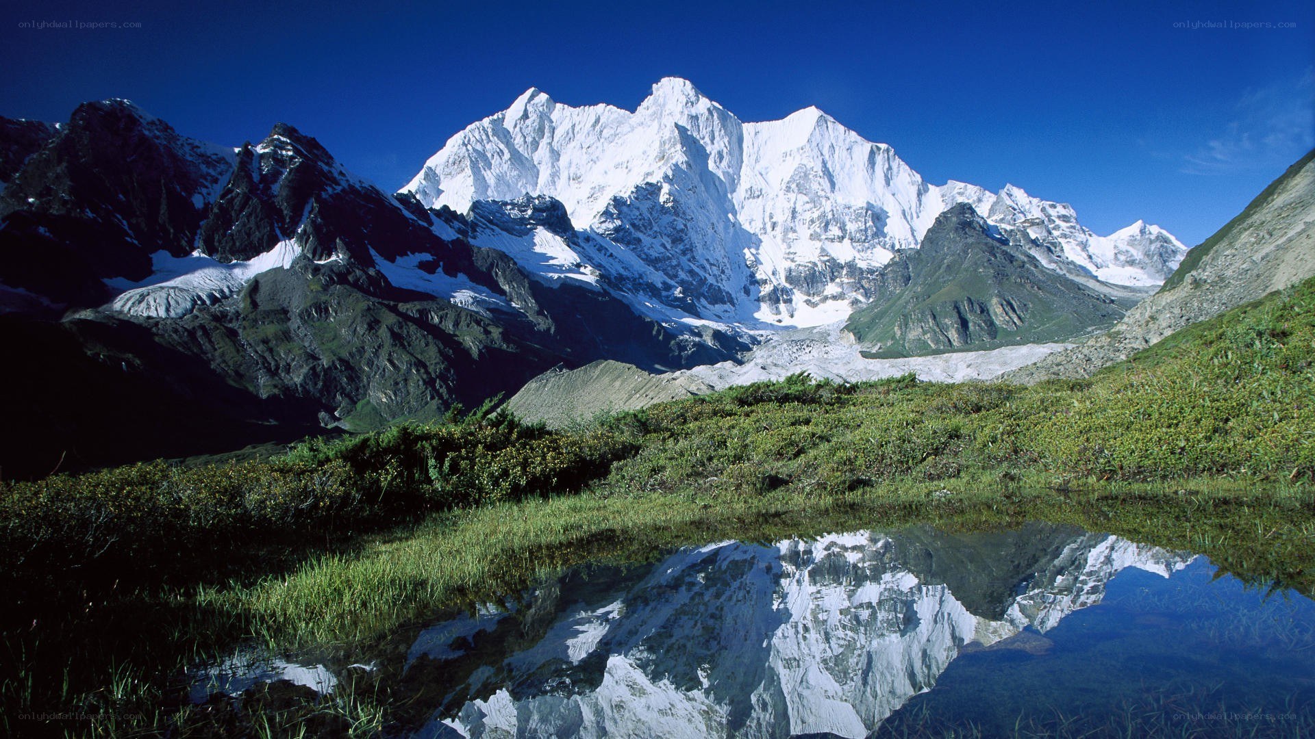 Snow-capped mountain reflected in a pond