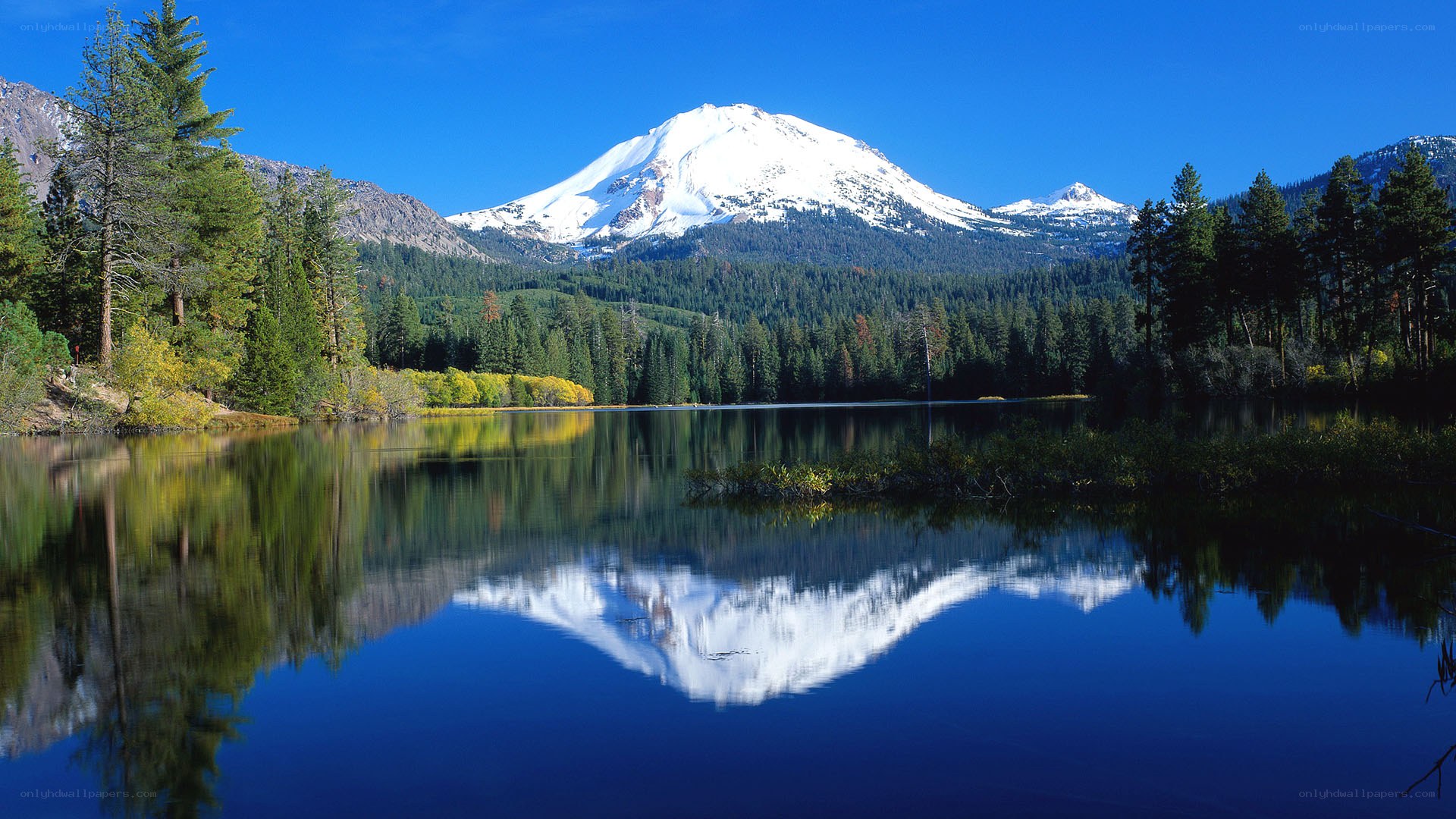 Snow-capped mountain reflected in lake