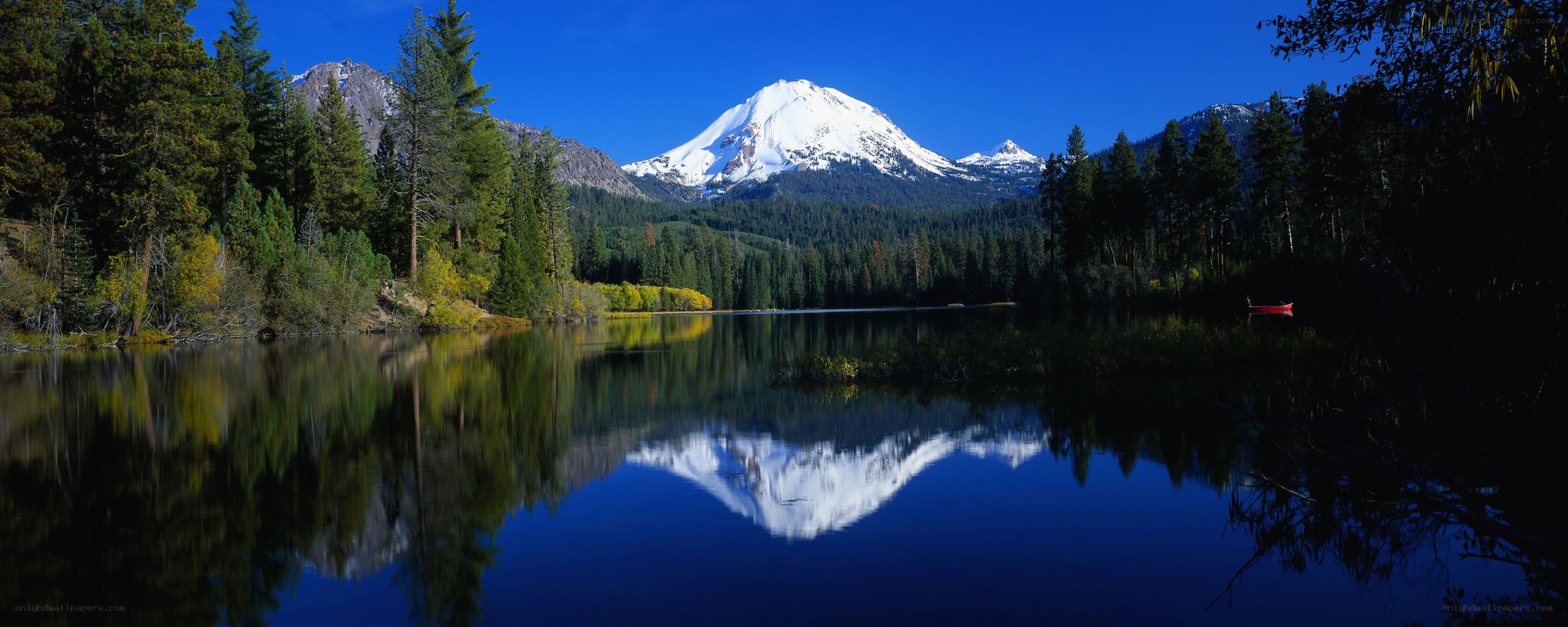 Snow-capped mountain reflected in lake
