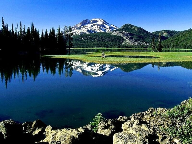 Snow-capped mountain reflected in lake