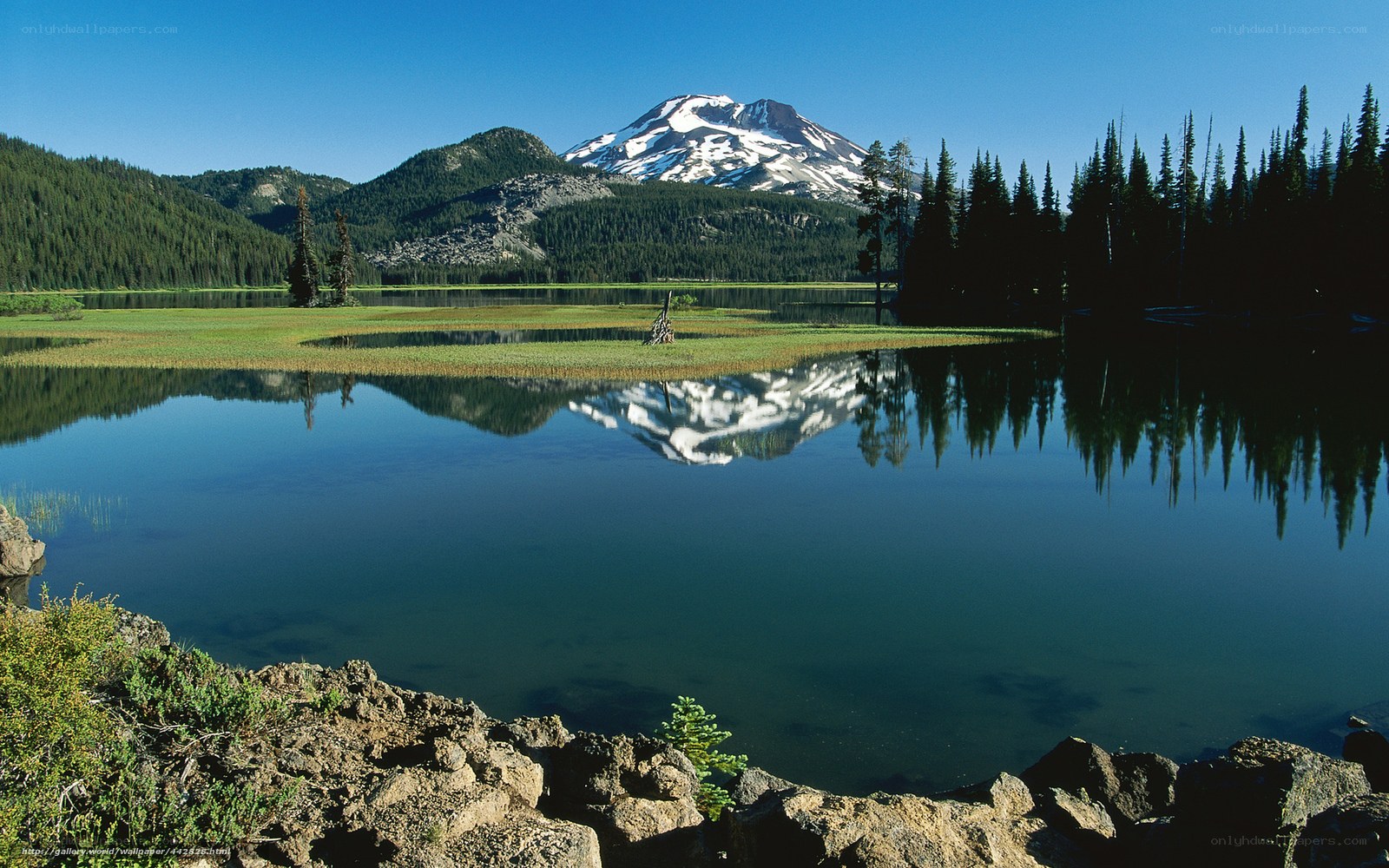 Snow-capped mountain reflected in lake