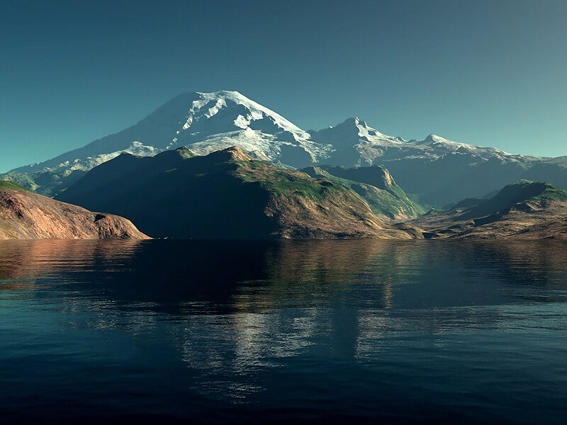 Snow-capped mountain reflected in lake