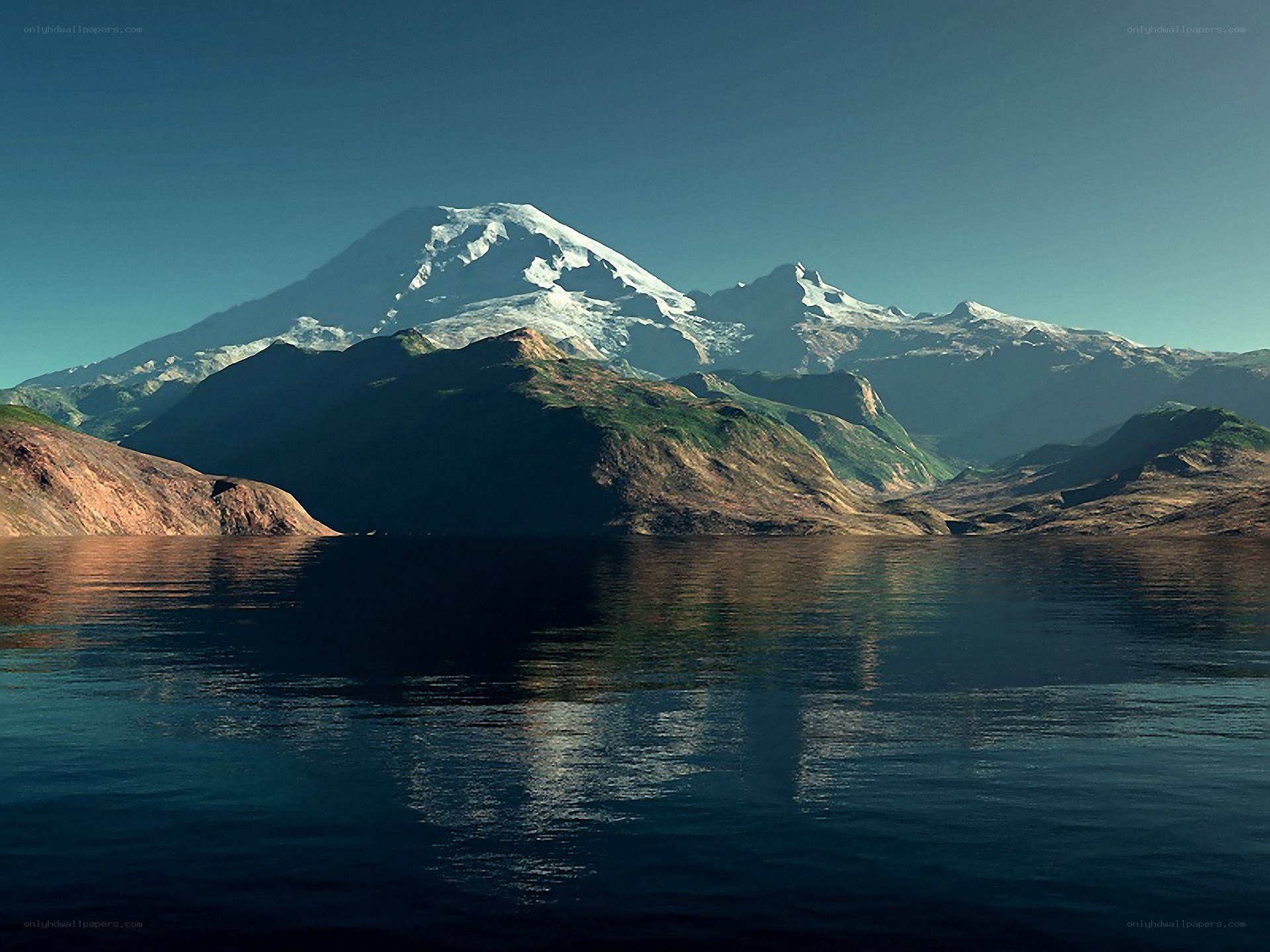 Snow-capped mountain reflected in lake