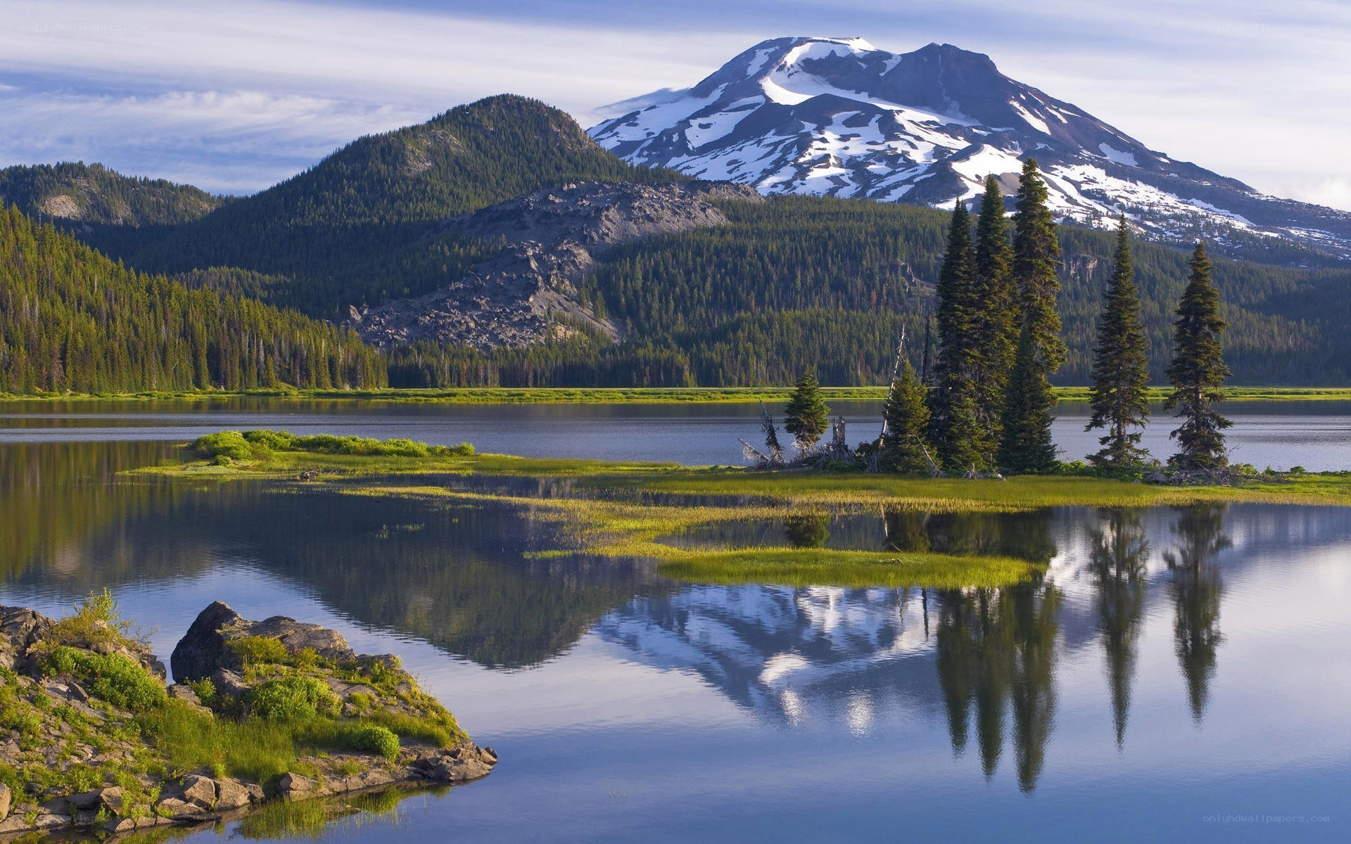 Snow-capped mountain reflected in lake