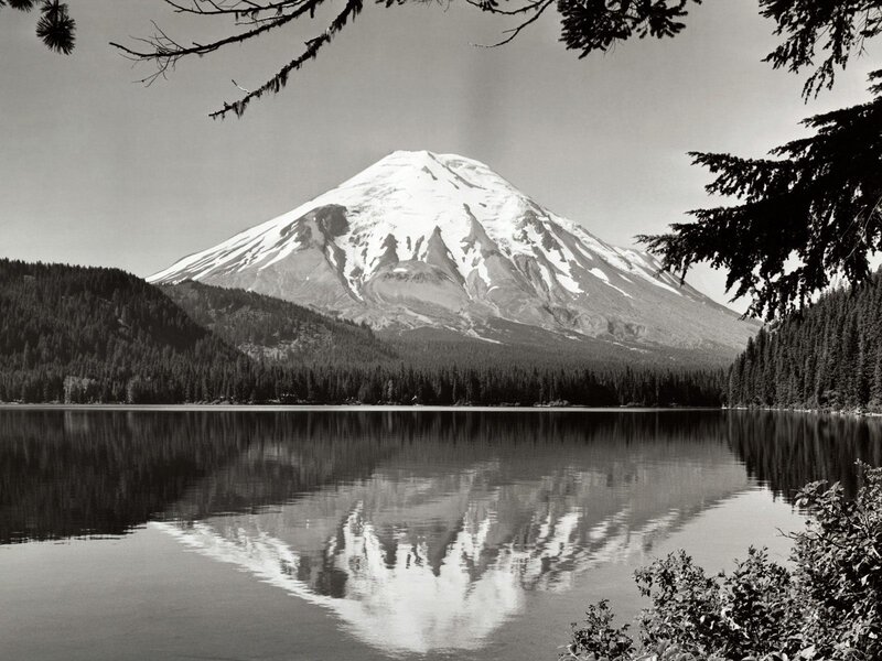 Snow-capped mountain reflected in lake