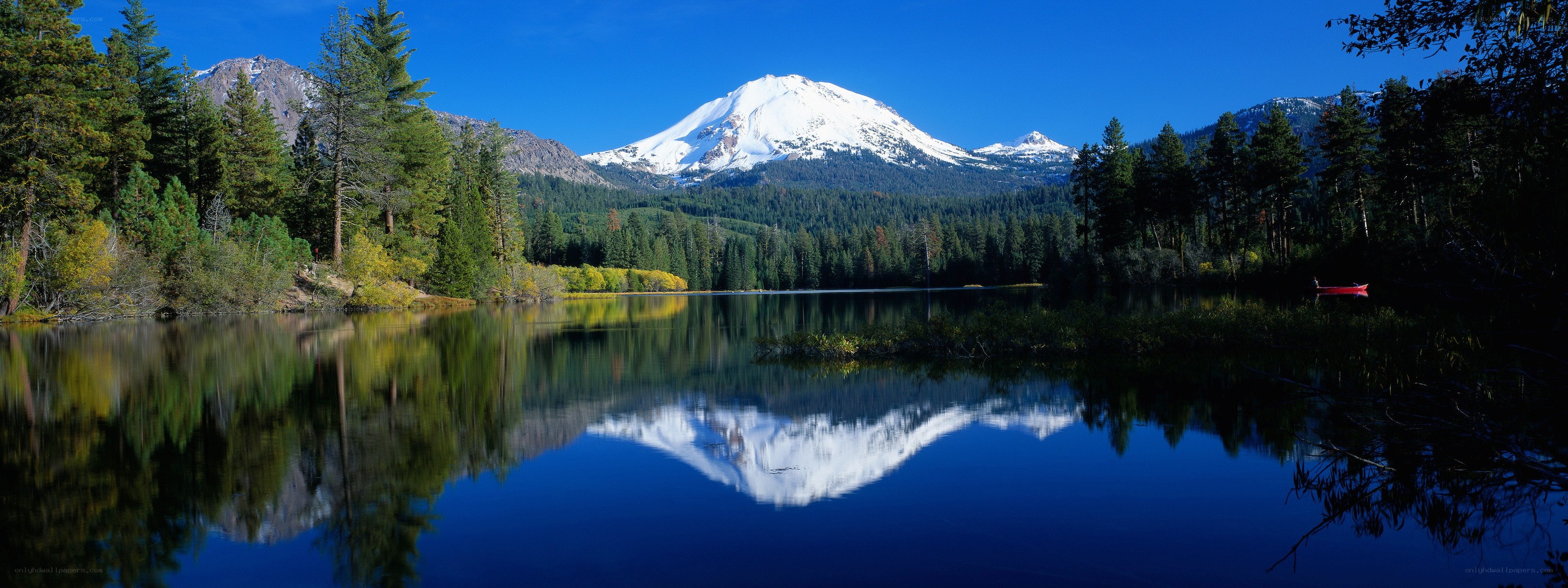 Snow-capped mountain reflected in lake
